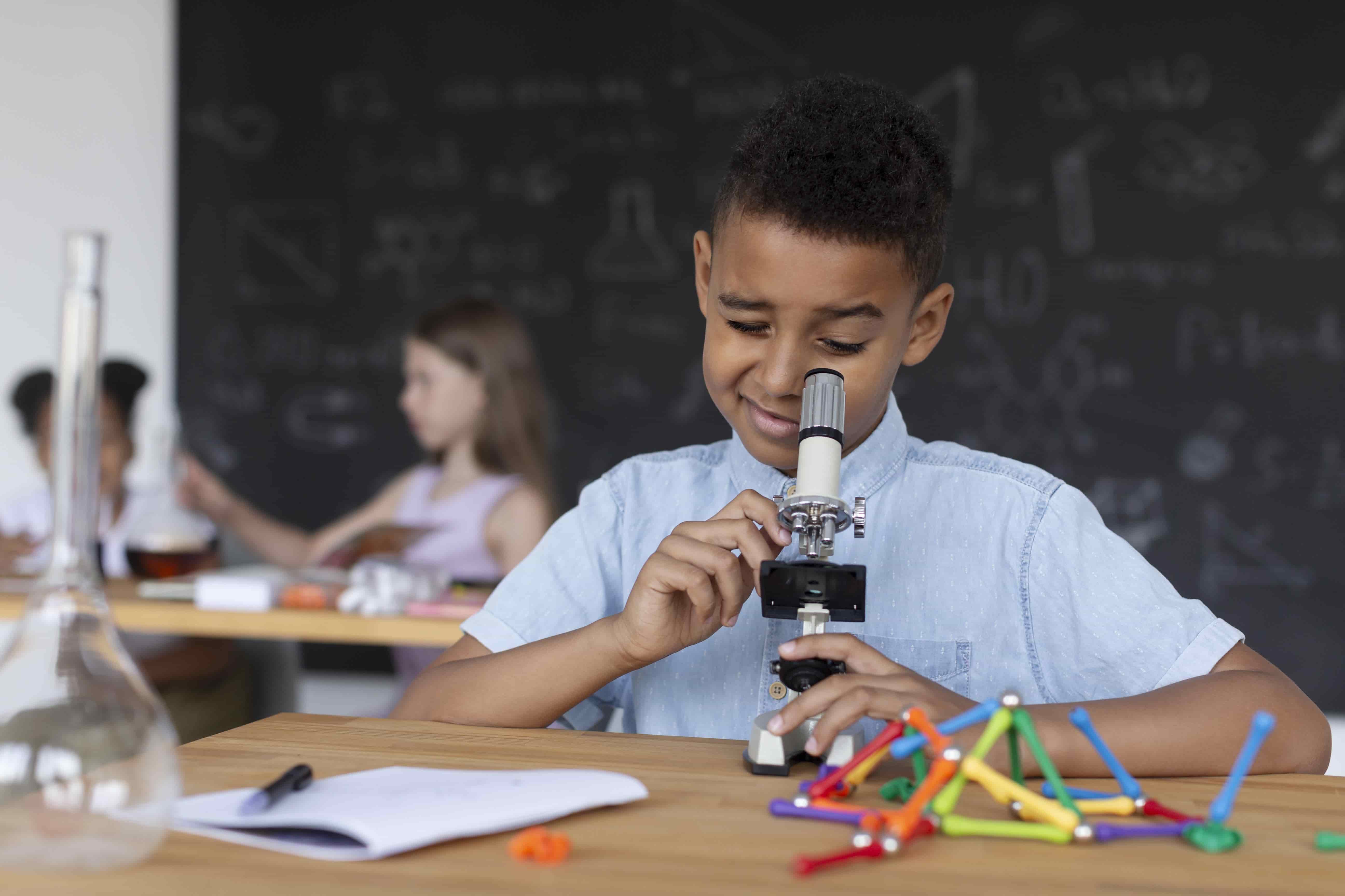 Students using school science lab equipment