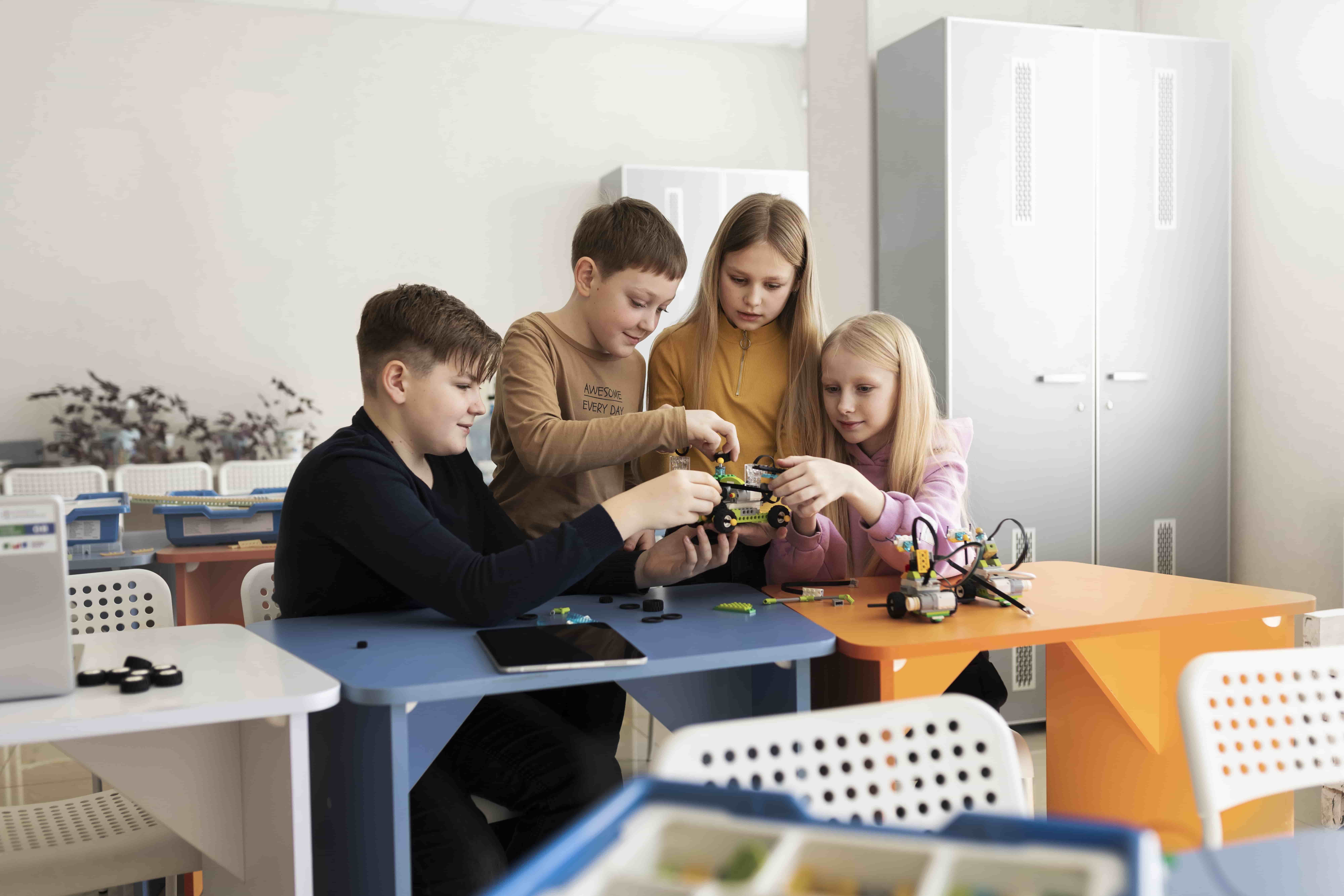 Students building a drone with STEM electronics kits